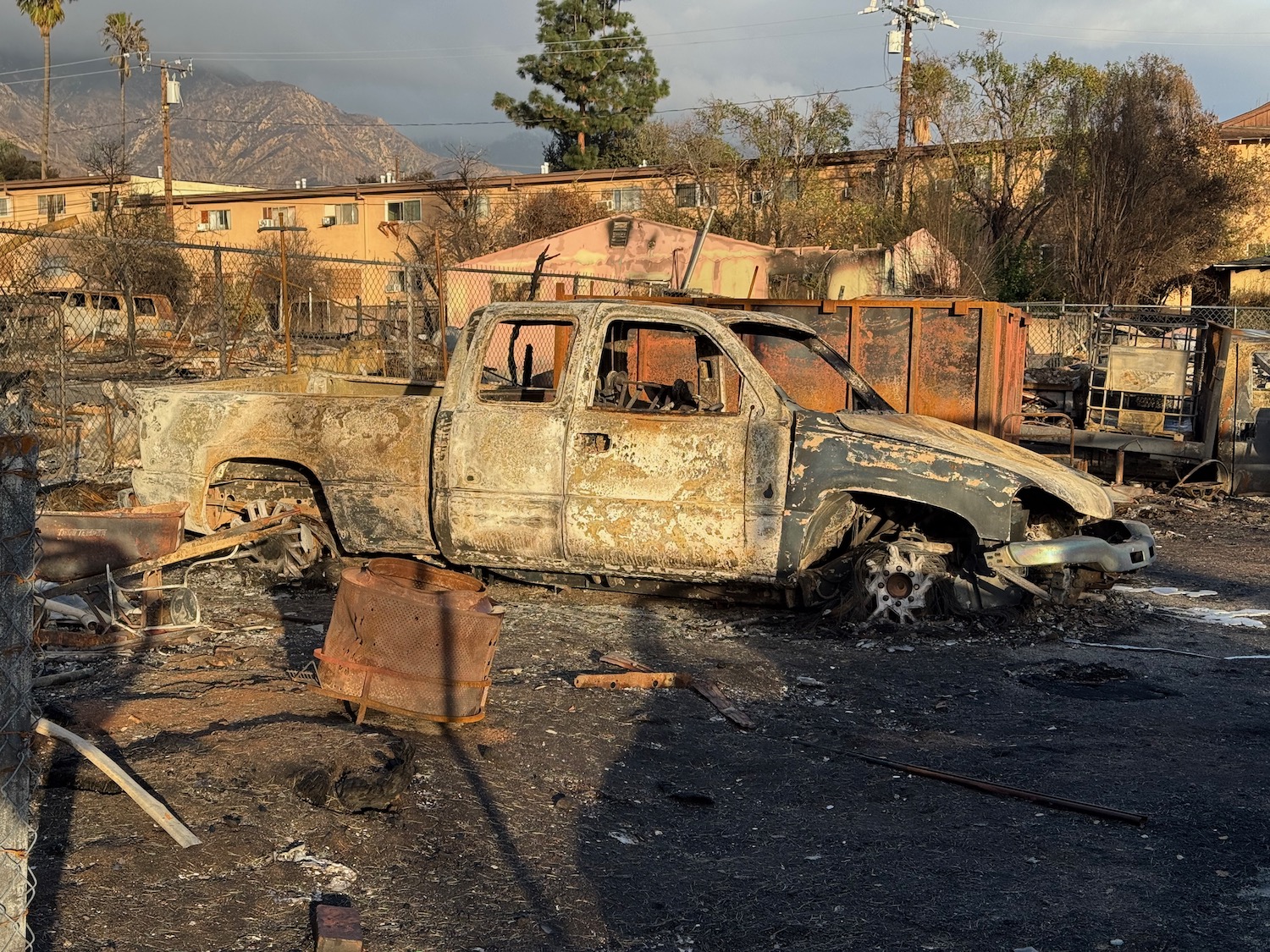 a burned out truck in a yard