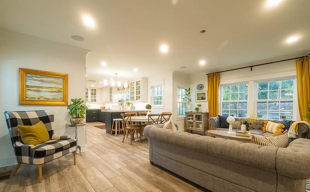 a living room with a couch and dining table