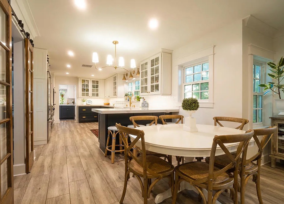 a kitchen with a table and chairs