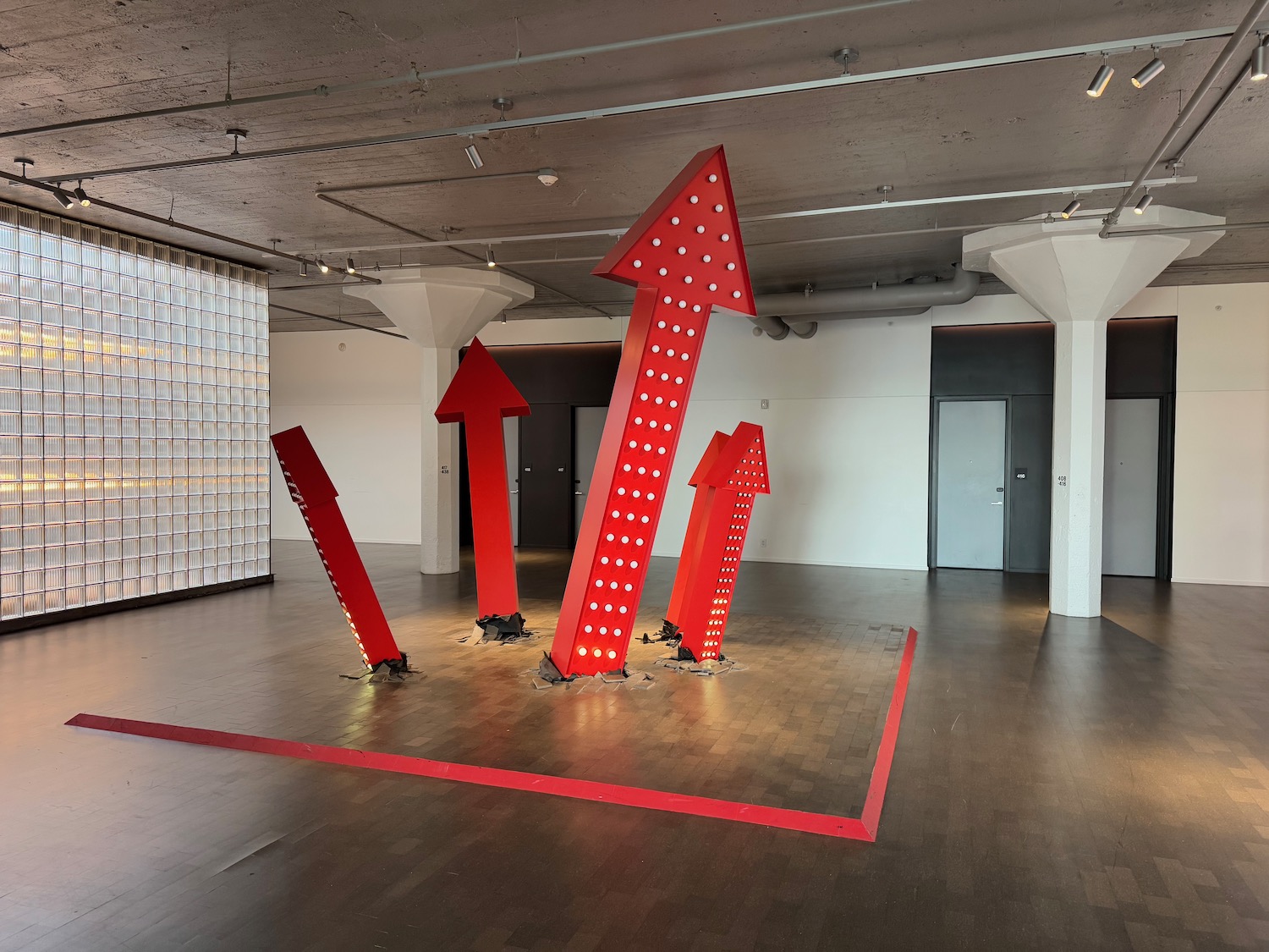 a group of red arrows in a room