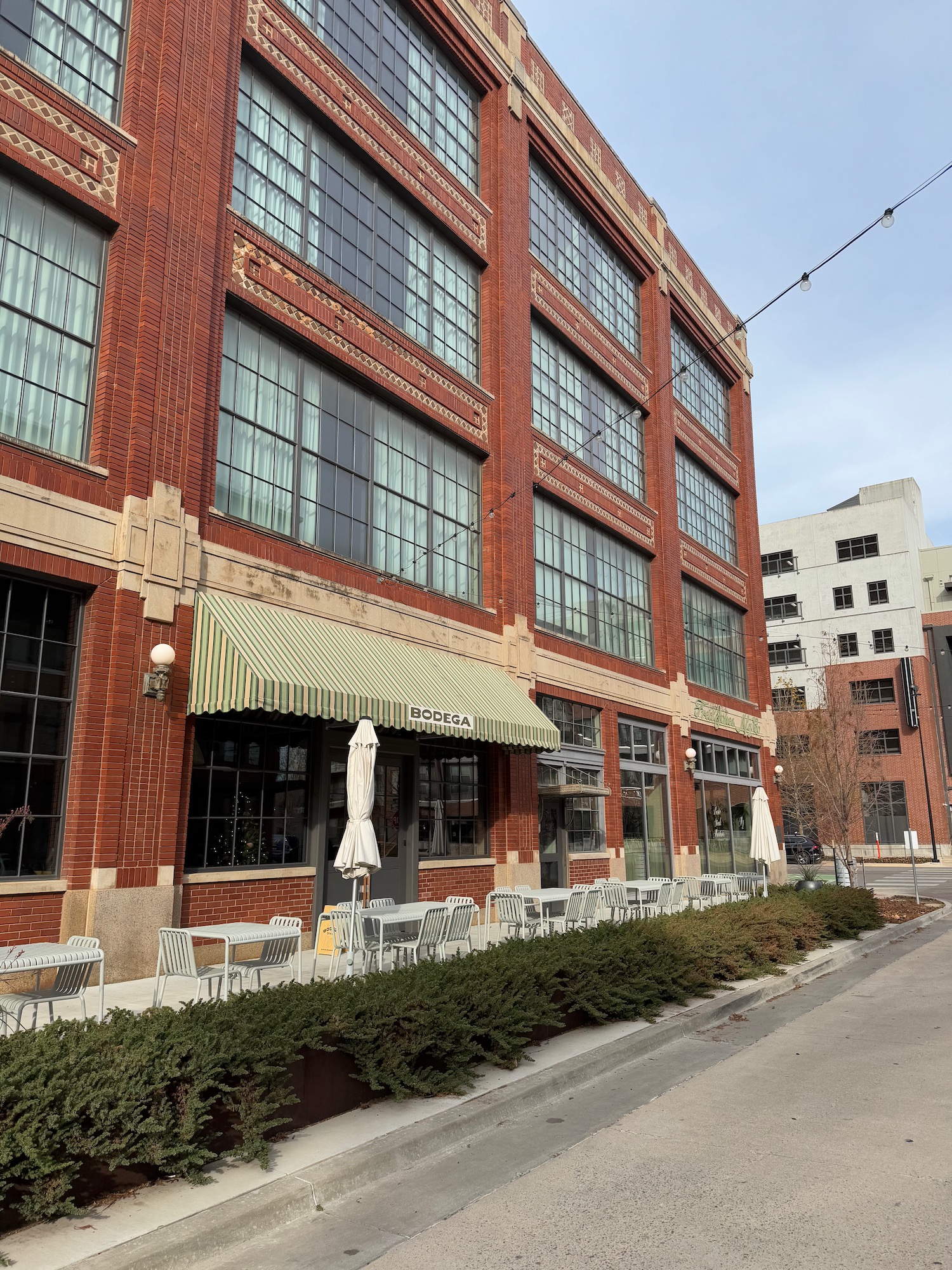 a building with windows and tables outside