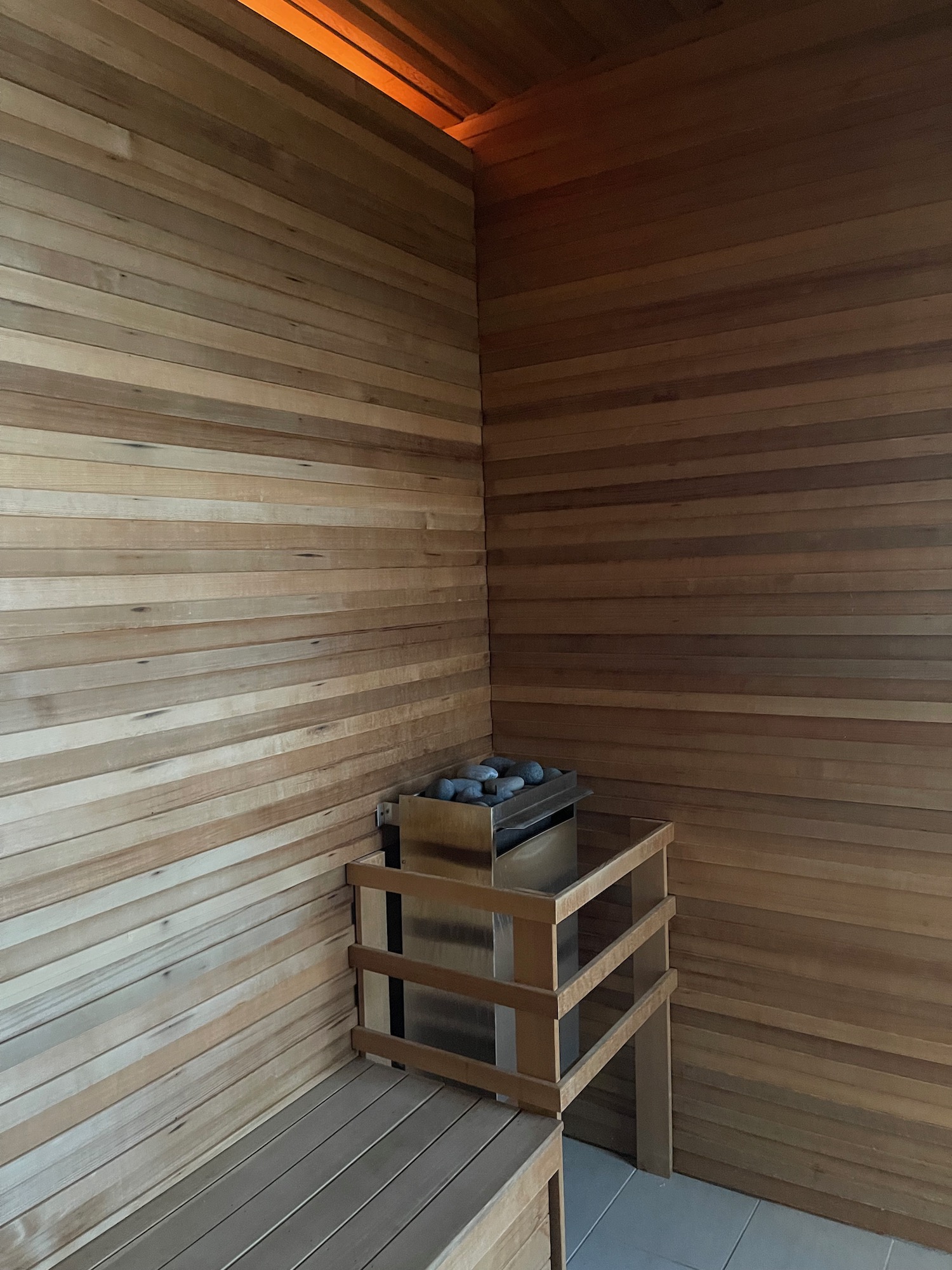 a wooden room with a wood wall and a box of charcoal