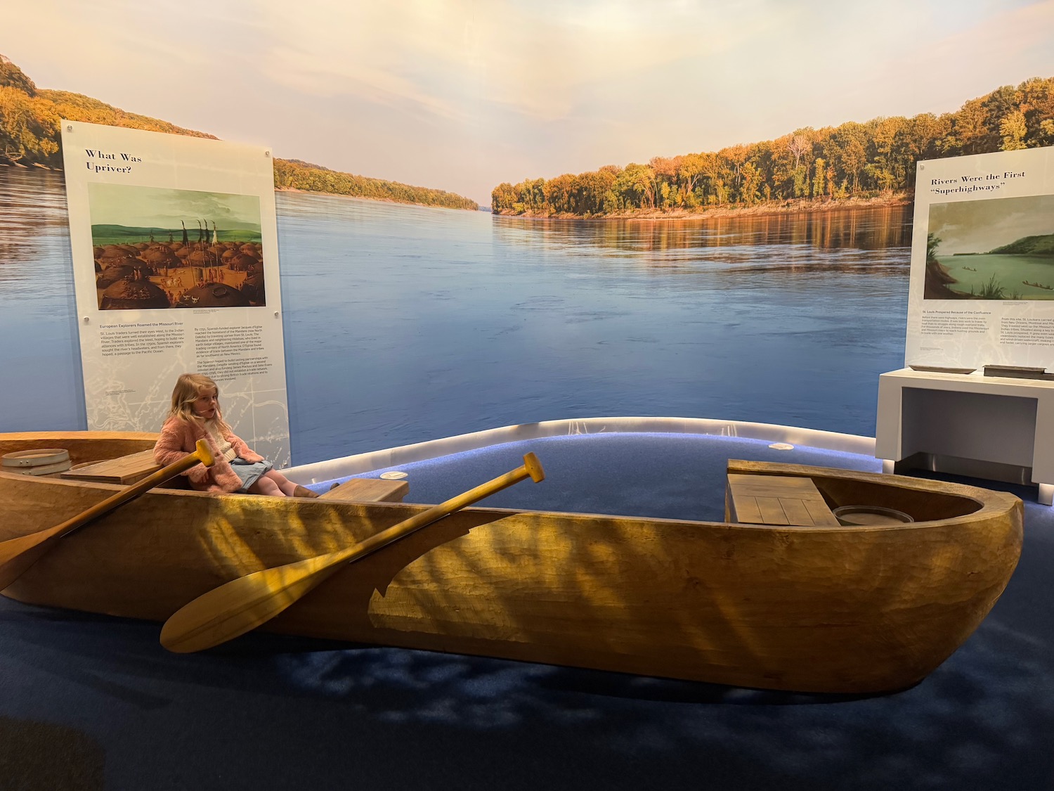 a child sitting in a canoe