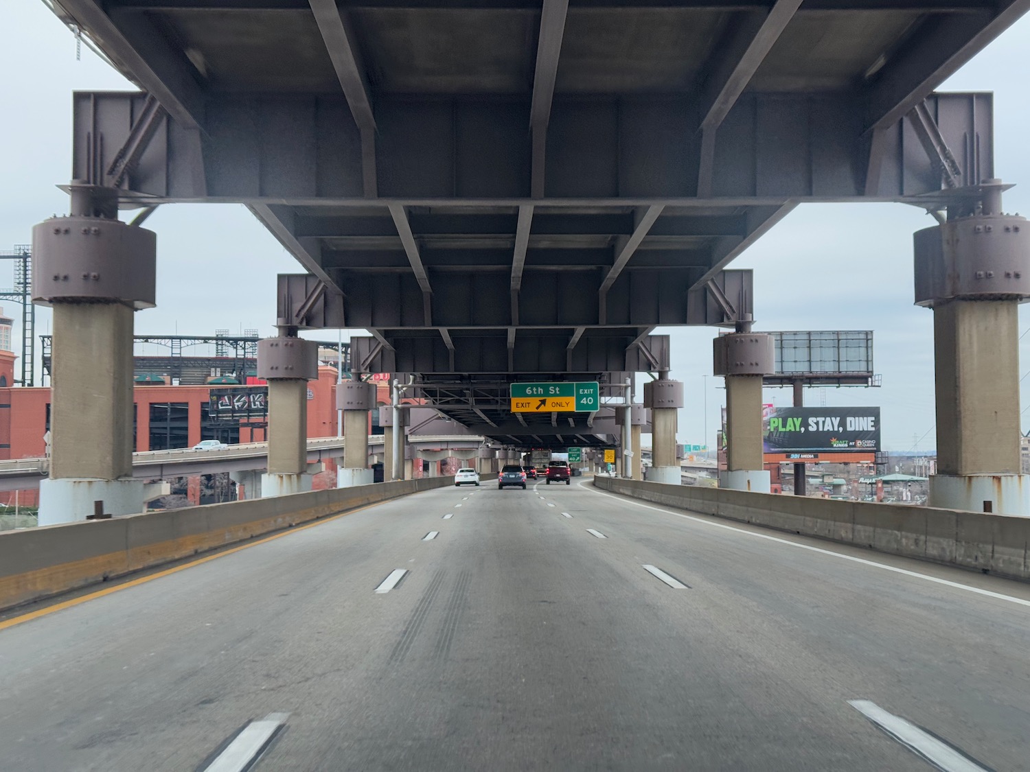 a highway with cars under it