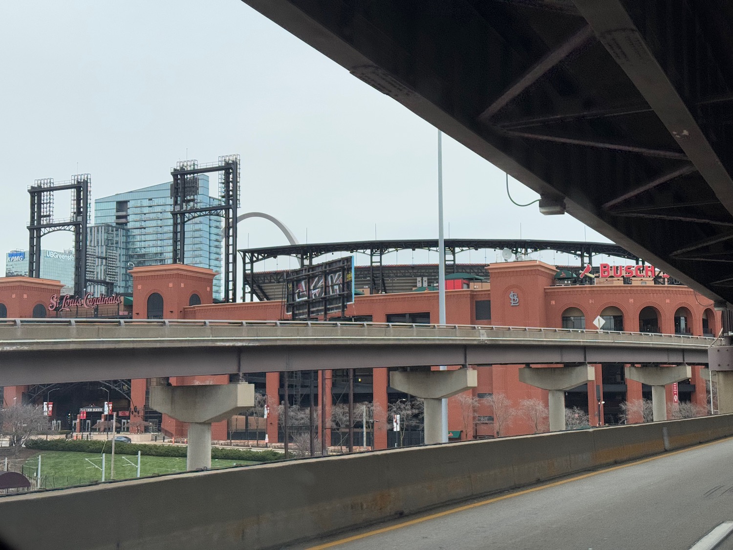 a road with a stadium in the background