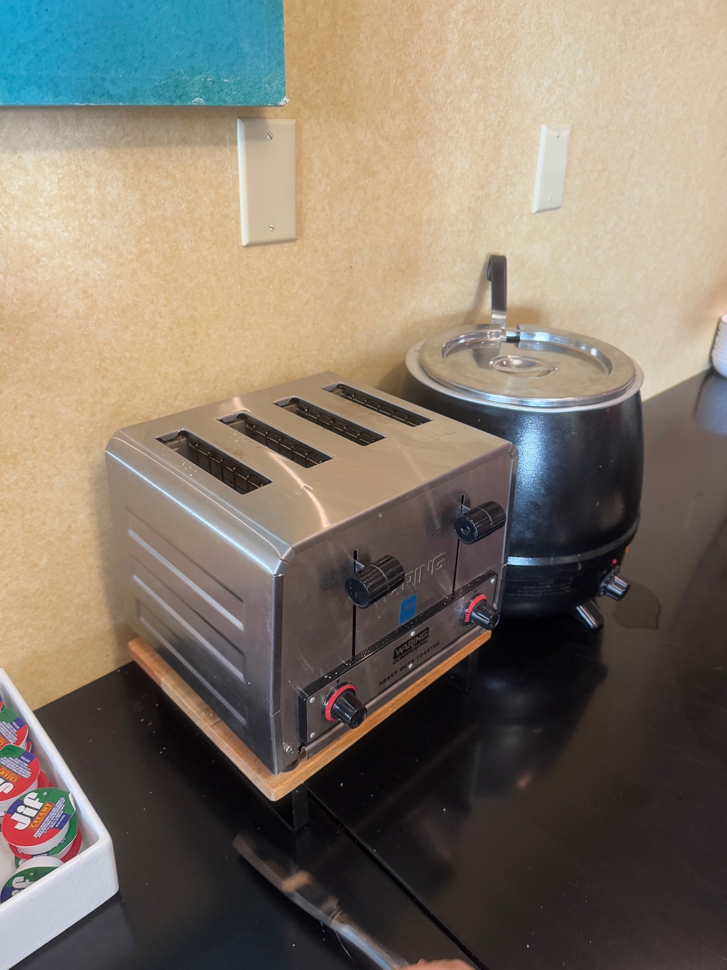 a toaster next to a pot