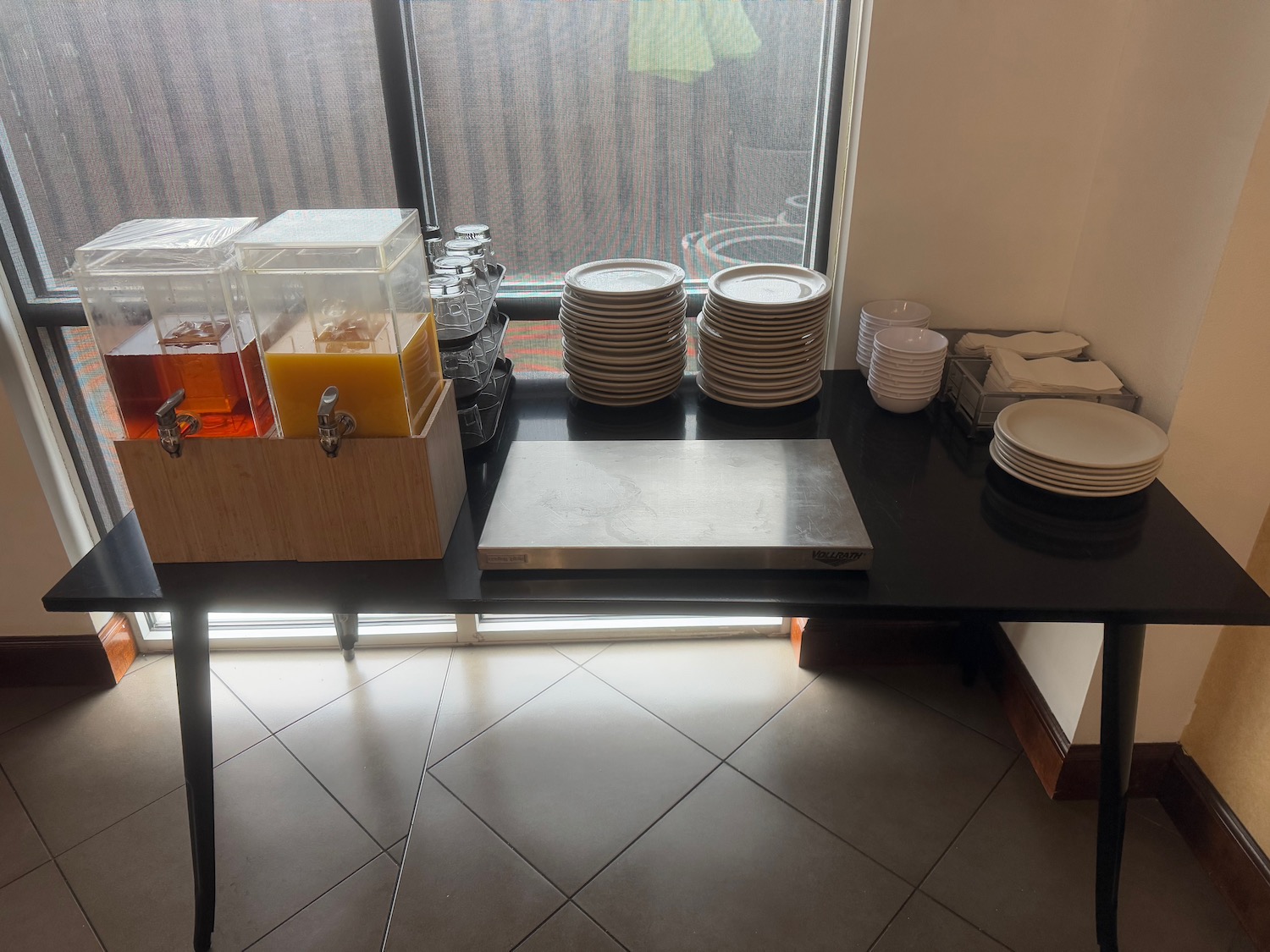 a table with plates and drinks on it