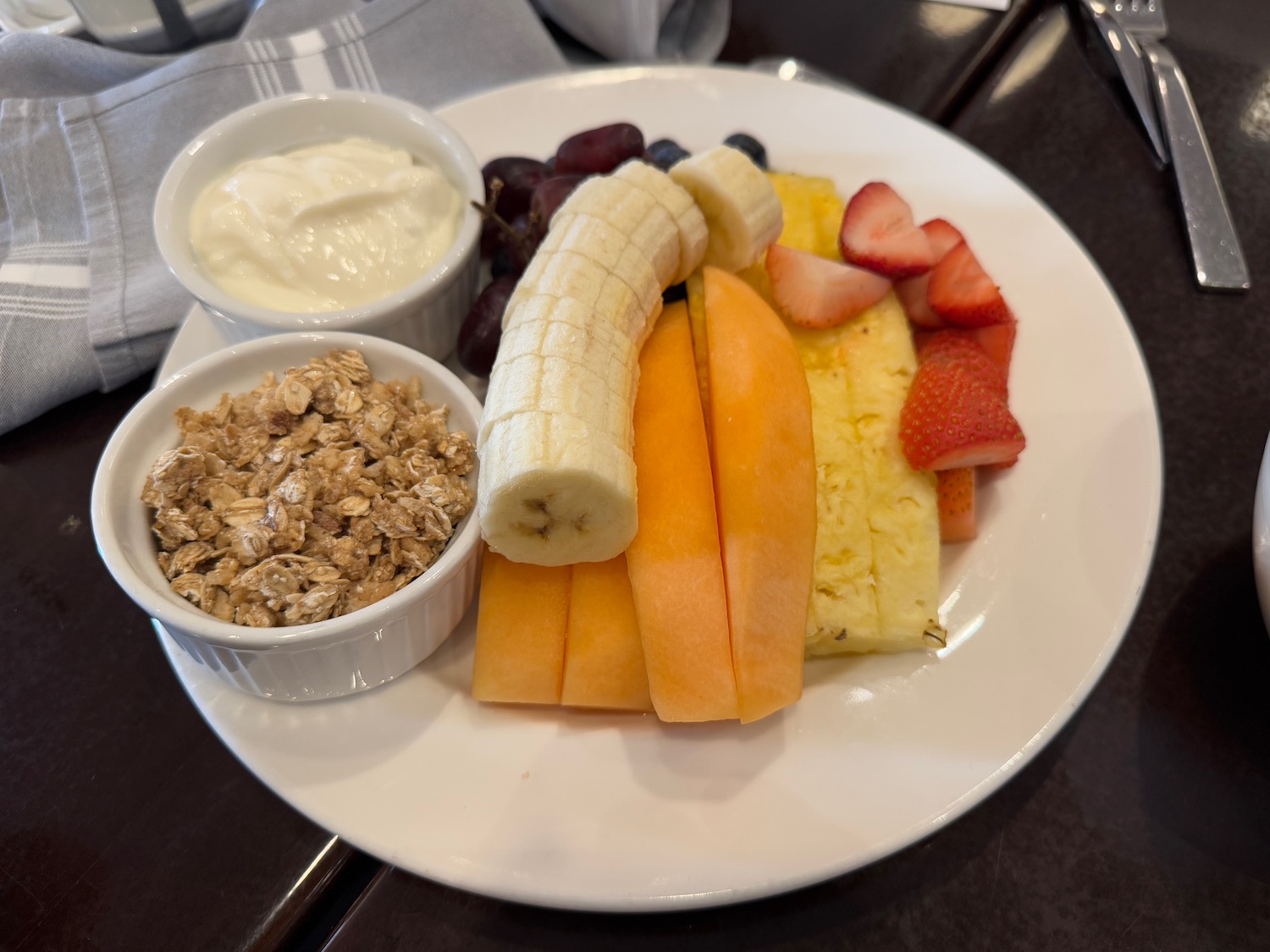 a plate of fruit and cereal