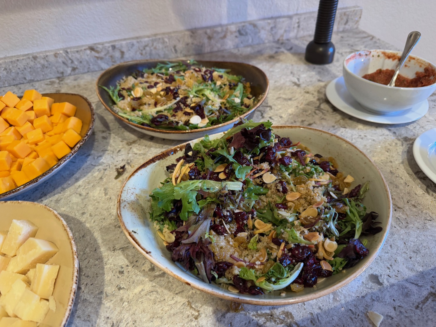 a group of bowls of food on a counter