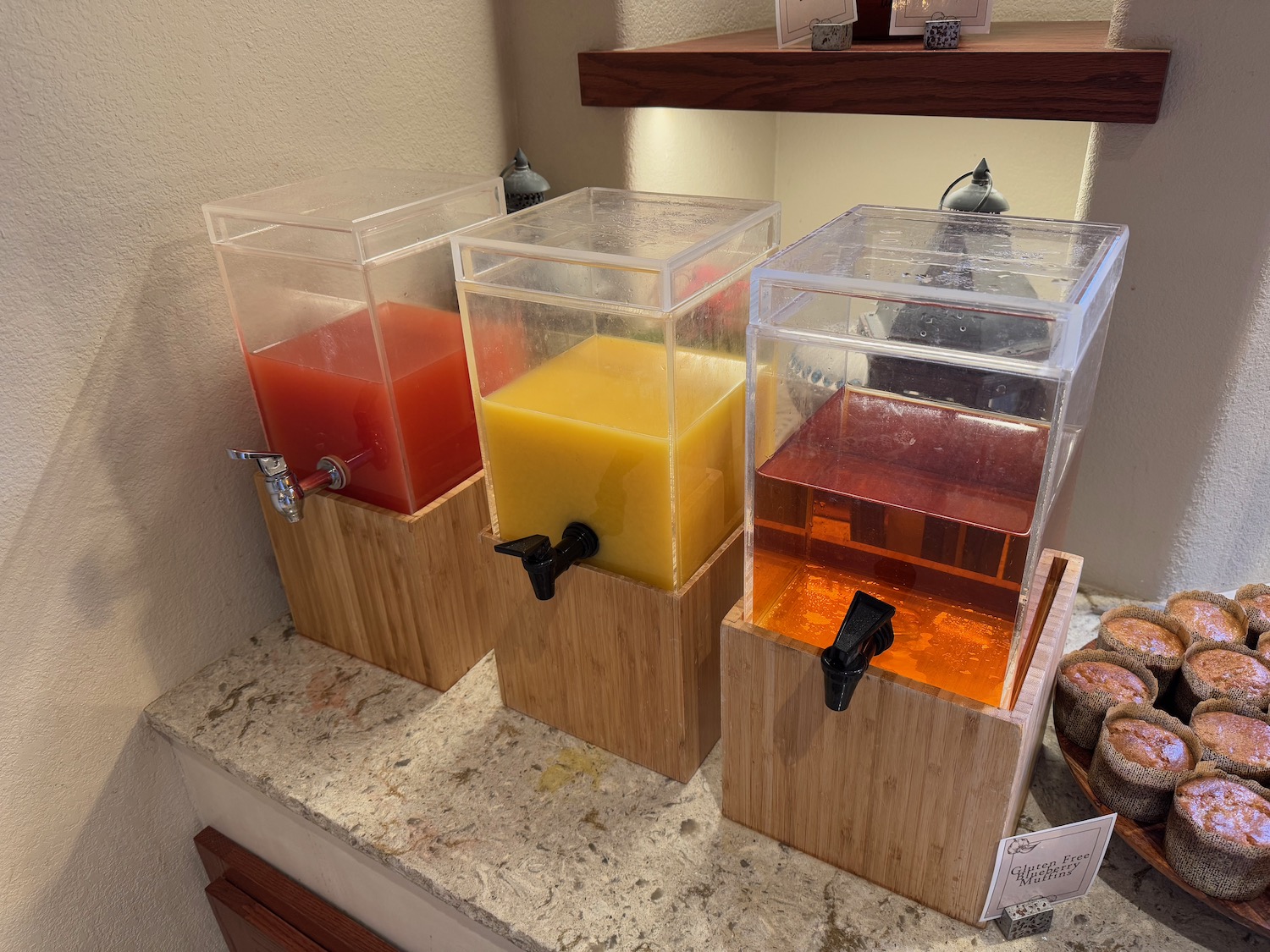 a group of liquid dispensers on a counter