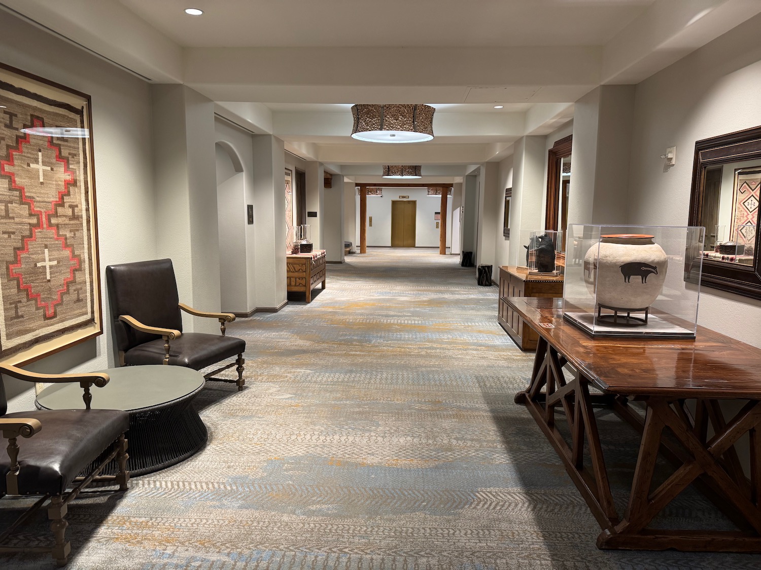 a hallway with chairs and tables