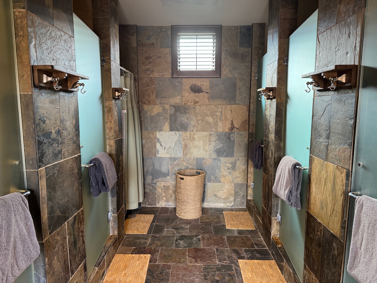 a bathroom with a basket and towels