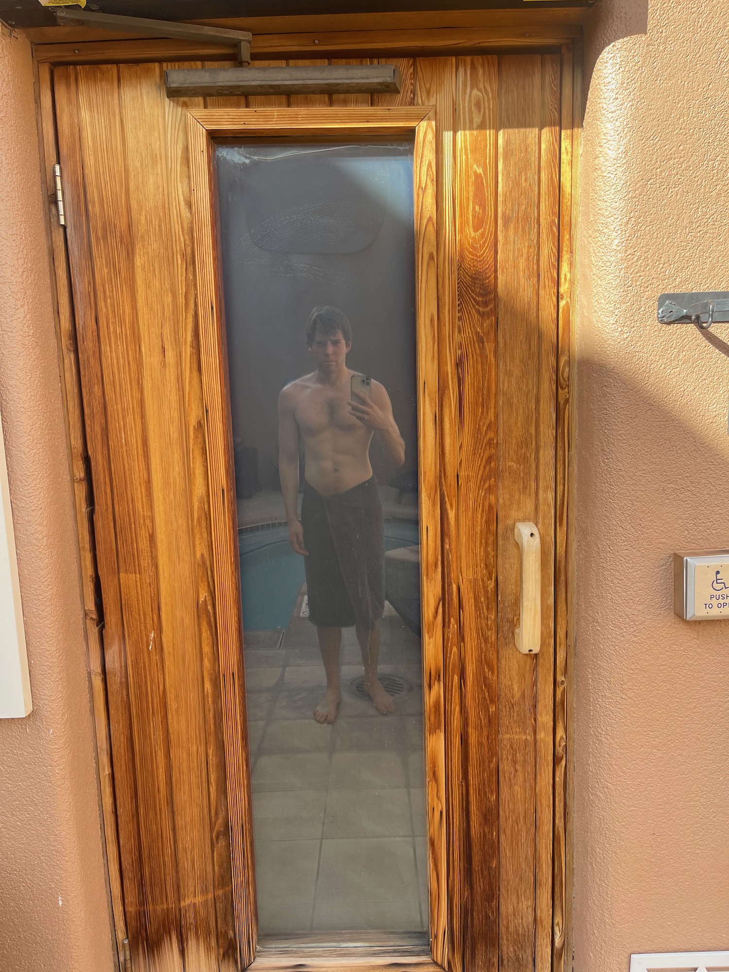 a man taking a selfie in a door