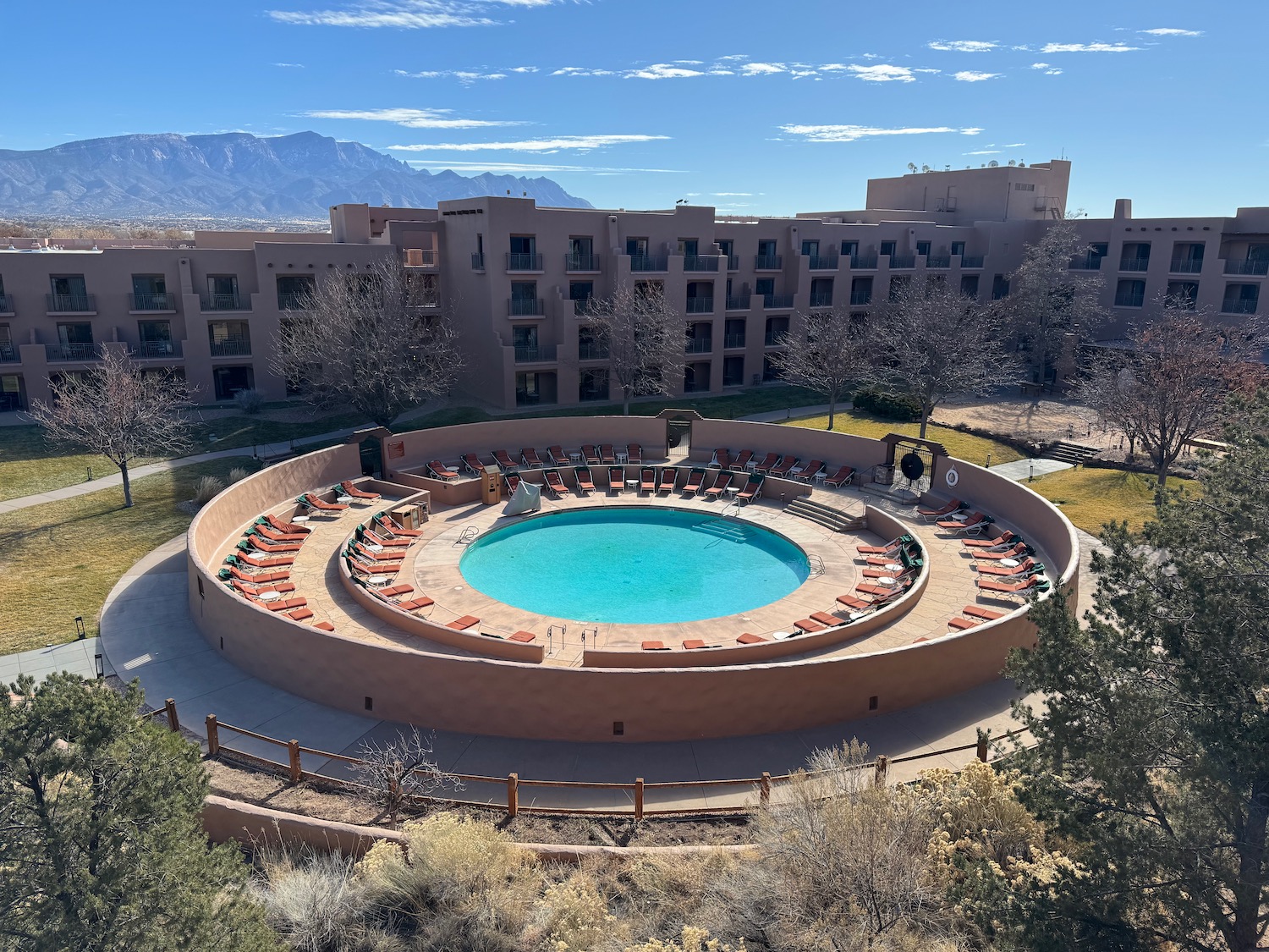 a pool with chairs around it