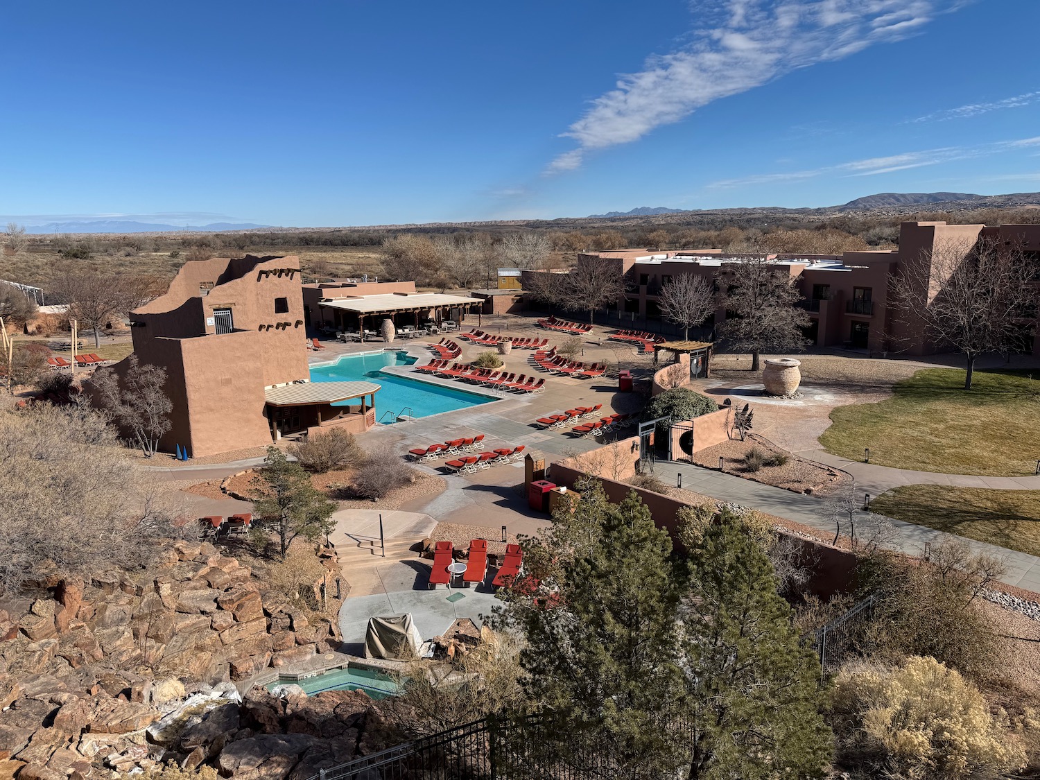 a pool and a building with a pool in the middle