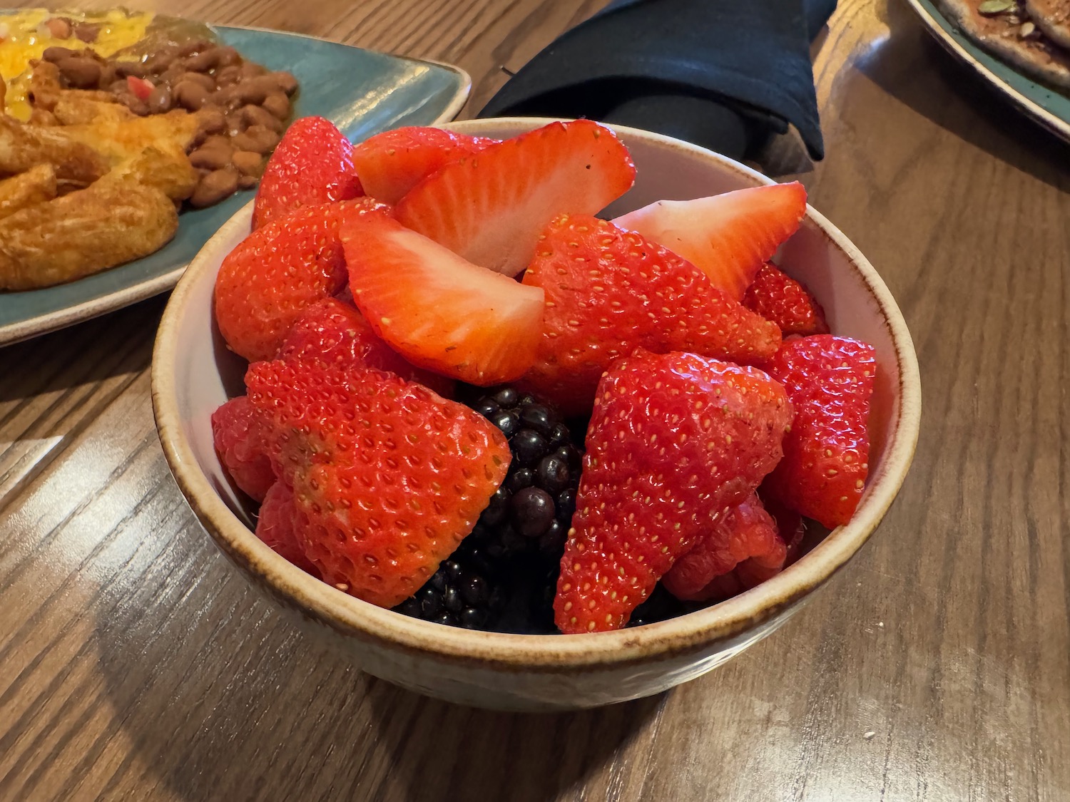 a bowl of strawberries and blackberries