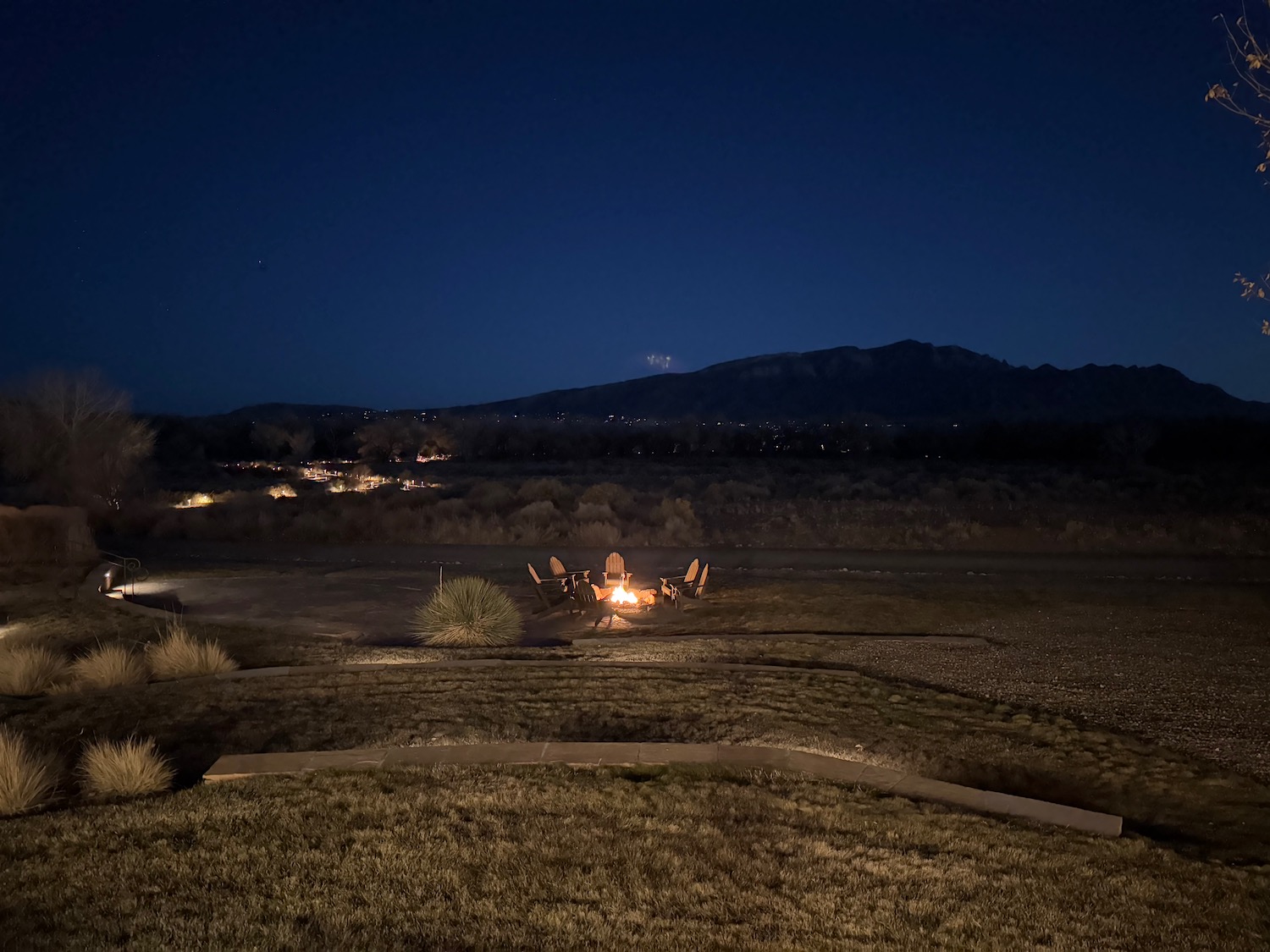 a campfire in a field at night