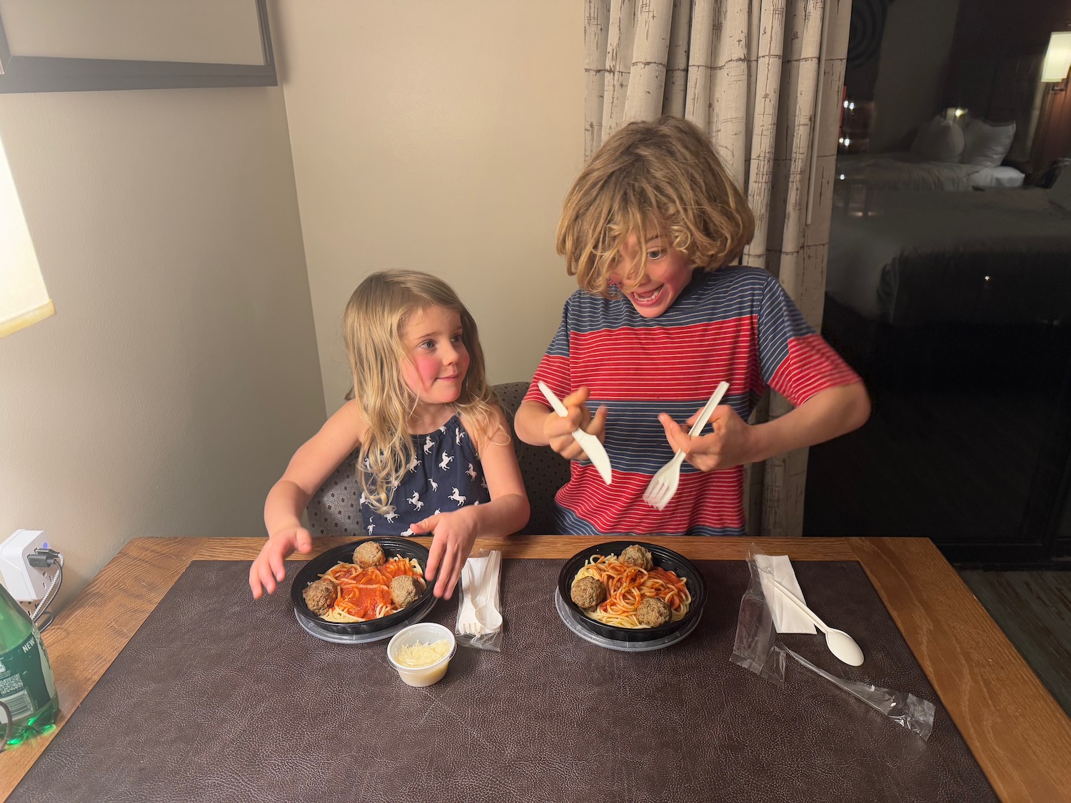 a boy and girl eating food