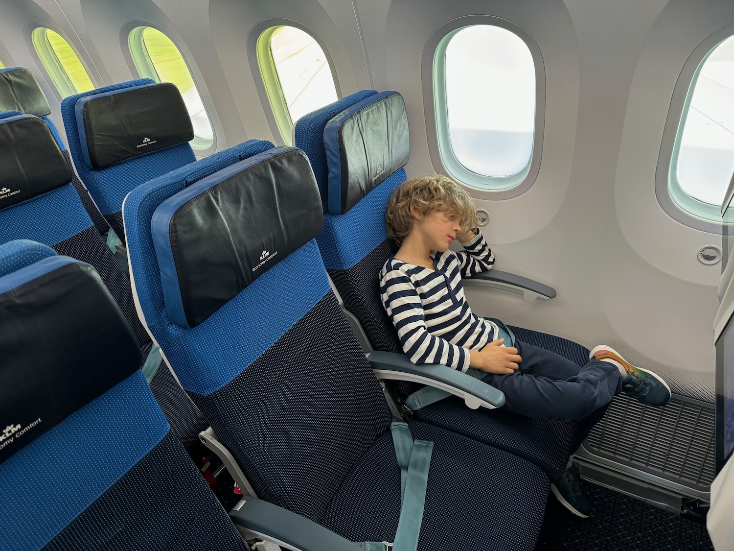 a person sleeping on an airplane