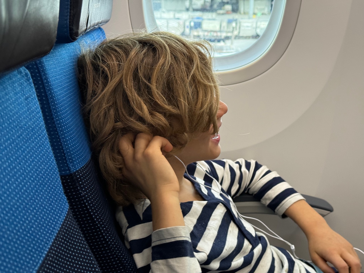 a child sitting in a plane