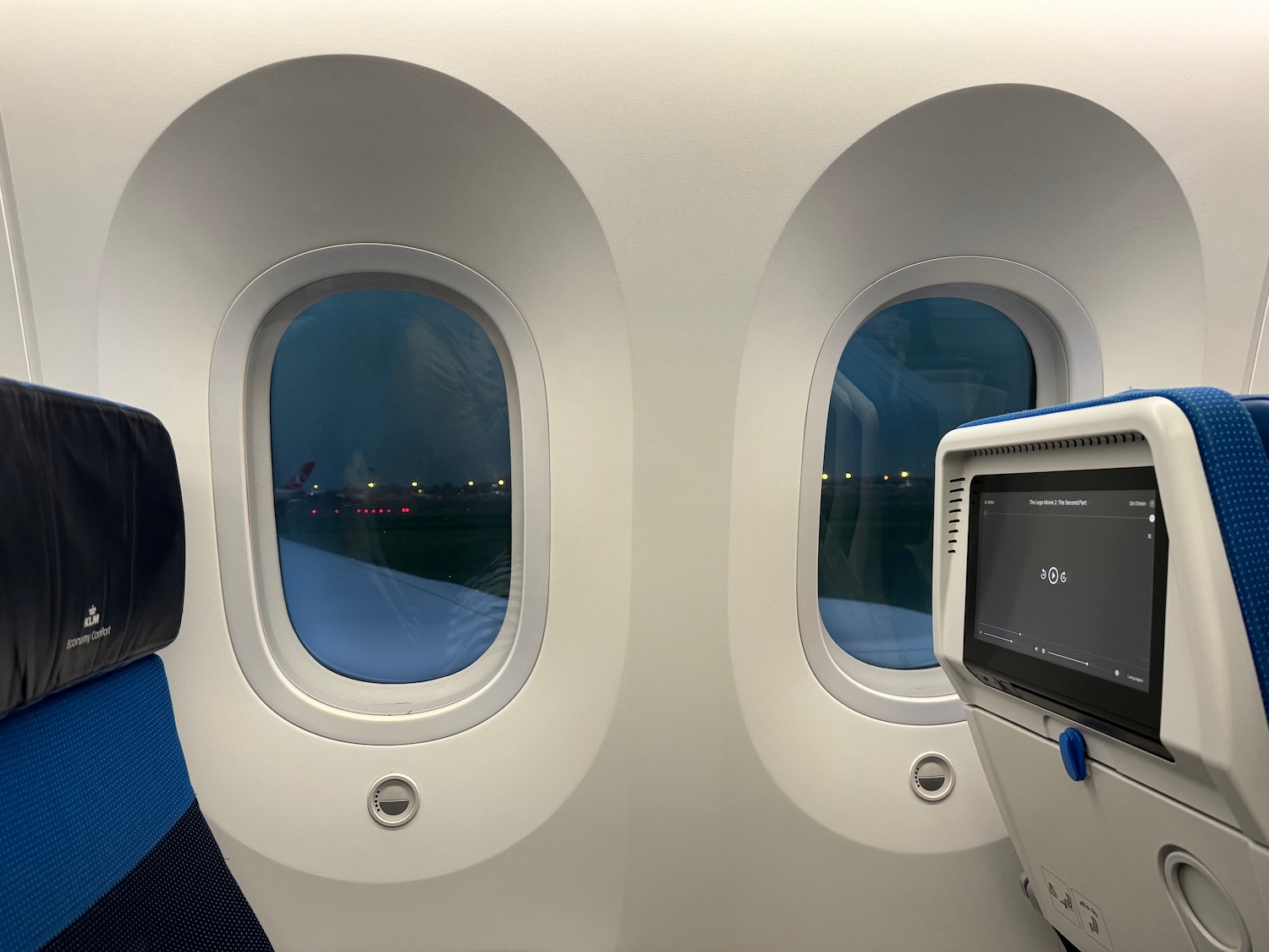 windows of an airplane with a screen and a monitor