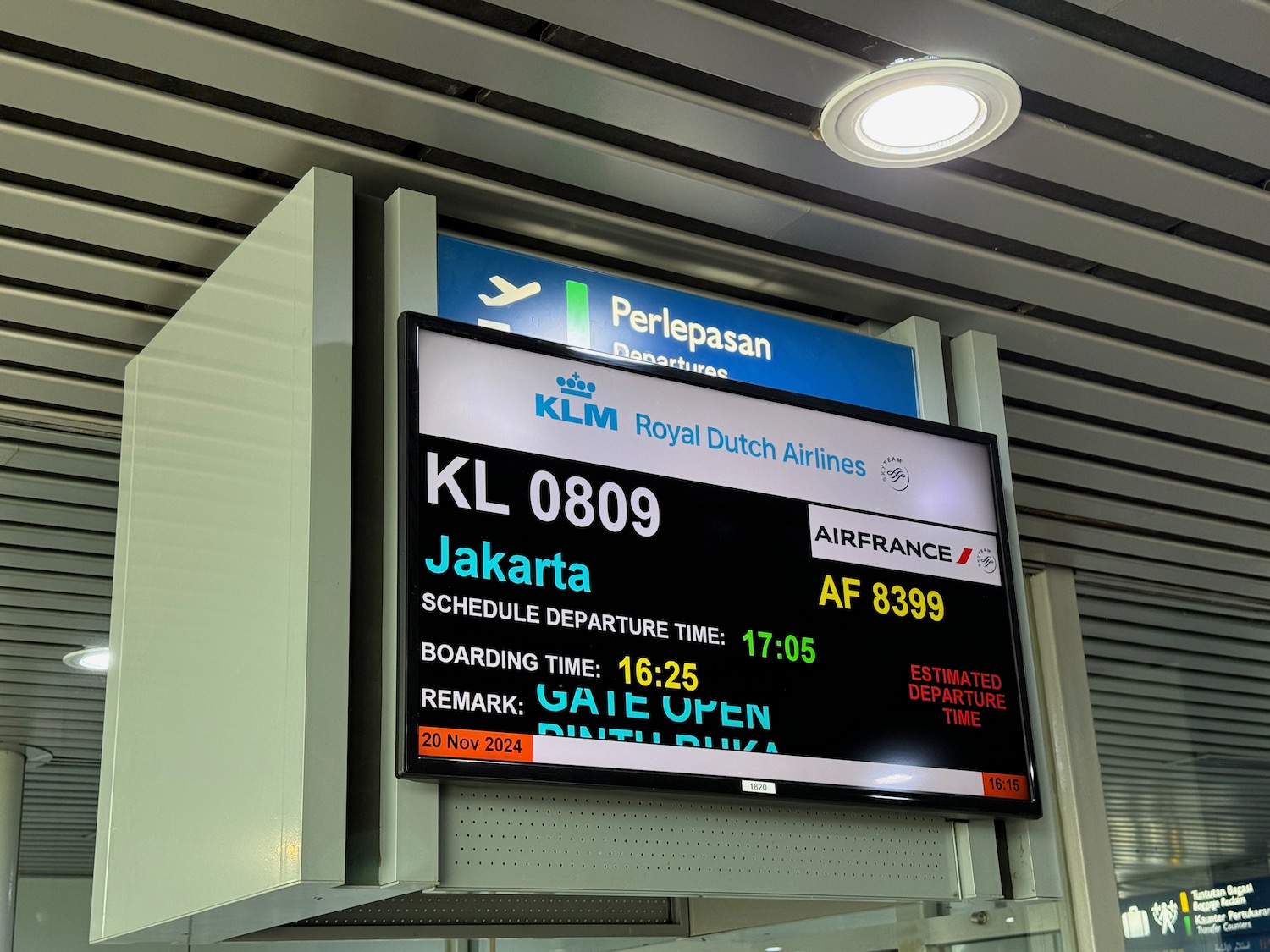 a sign board with a plane and an airplane