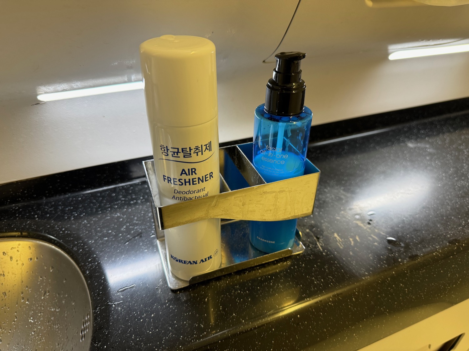 a bottle and spray in a holder