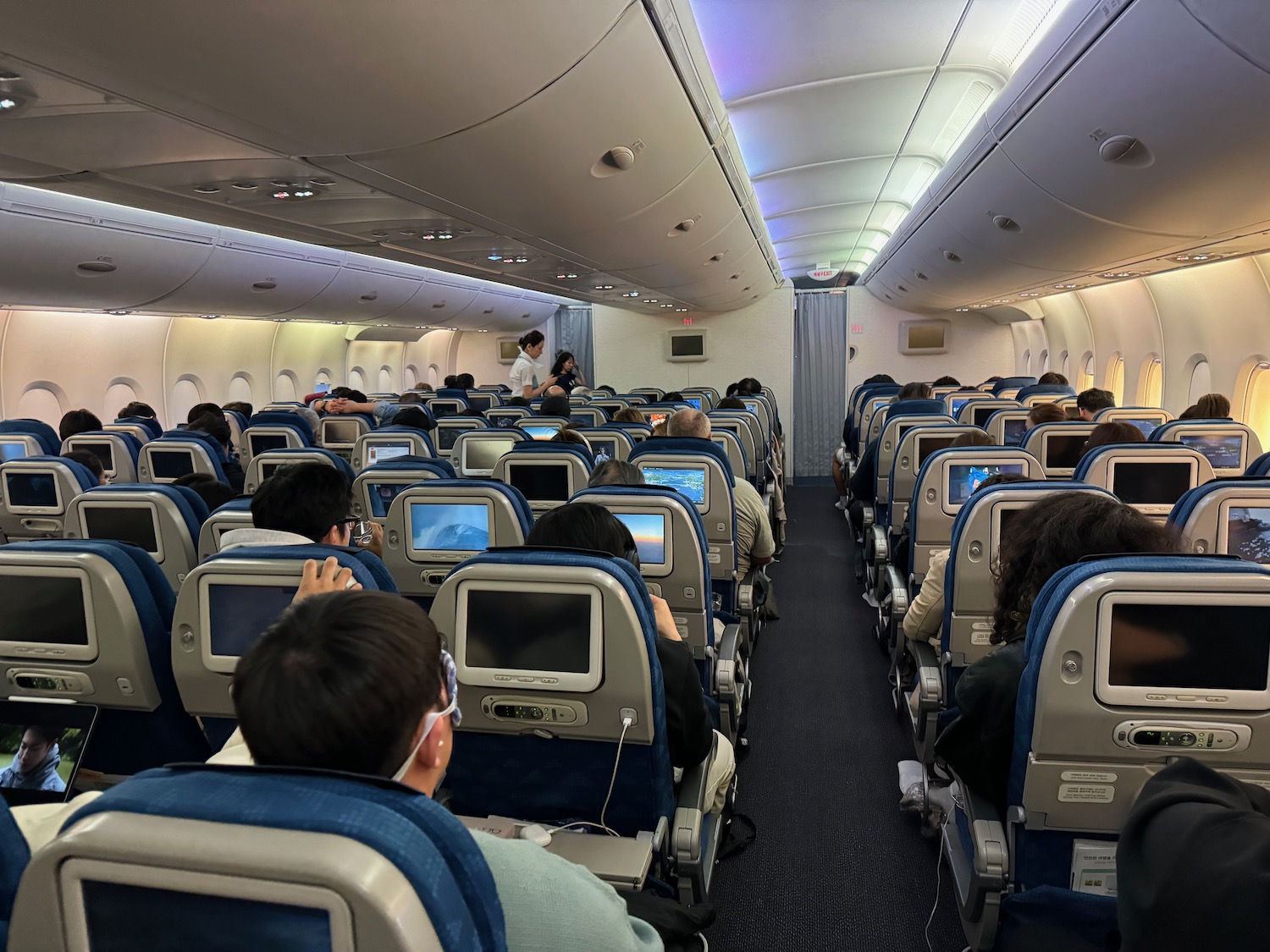 a group of people sitting in an airplane