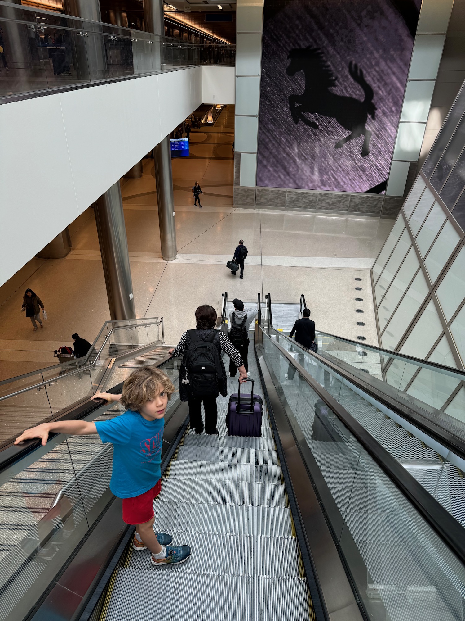 a group of people on an escalator