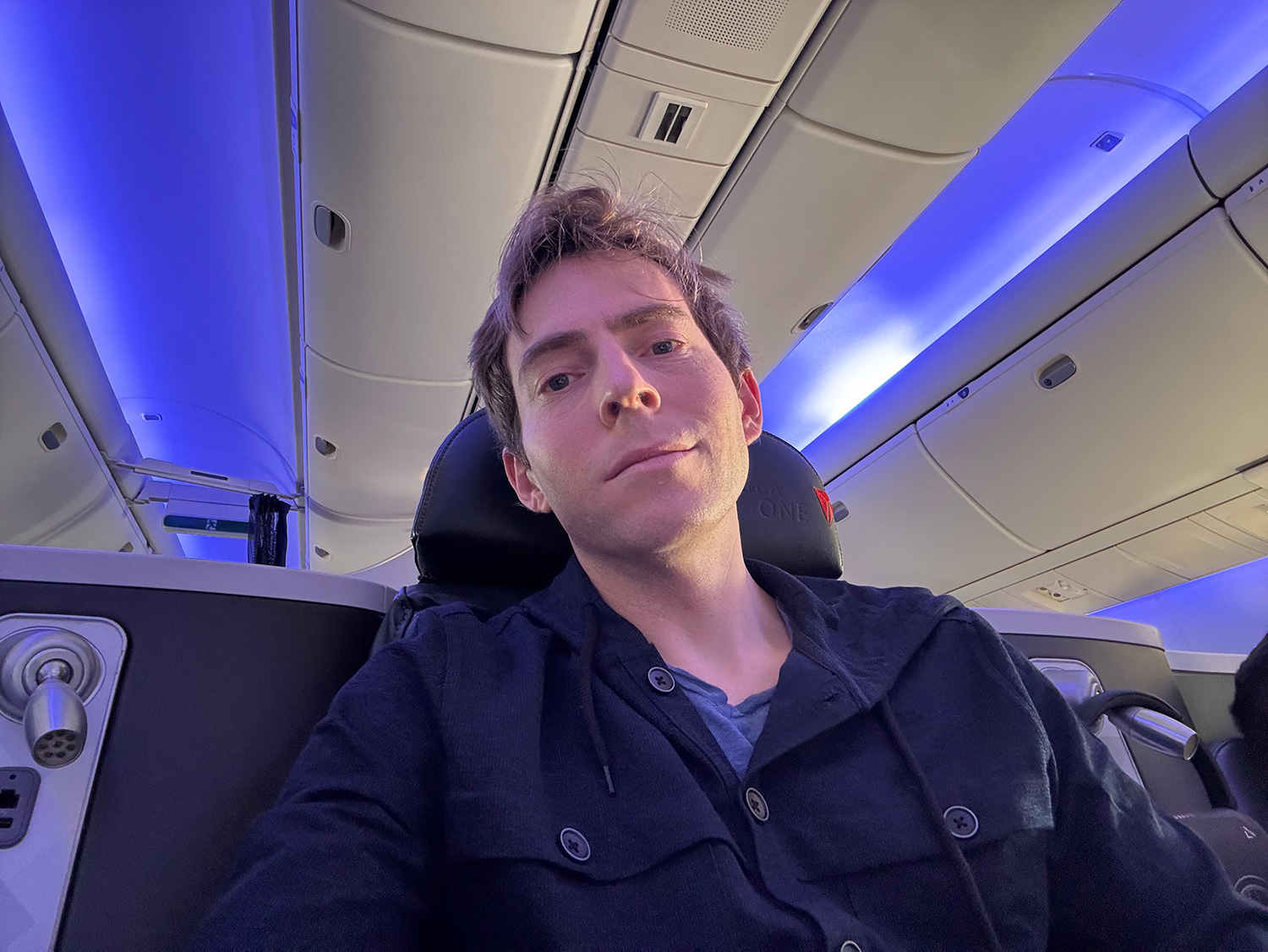 a man sitting in an airplane