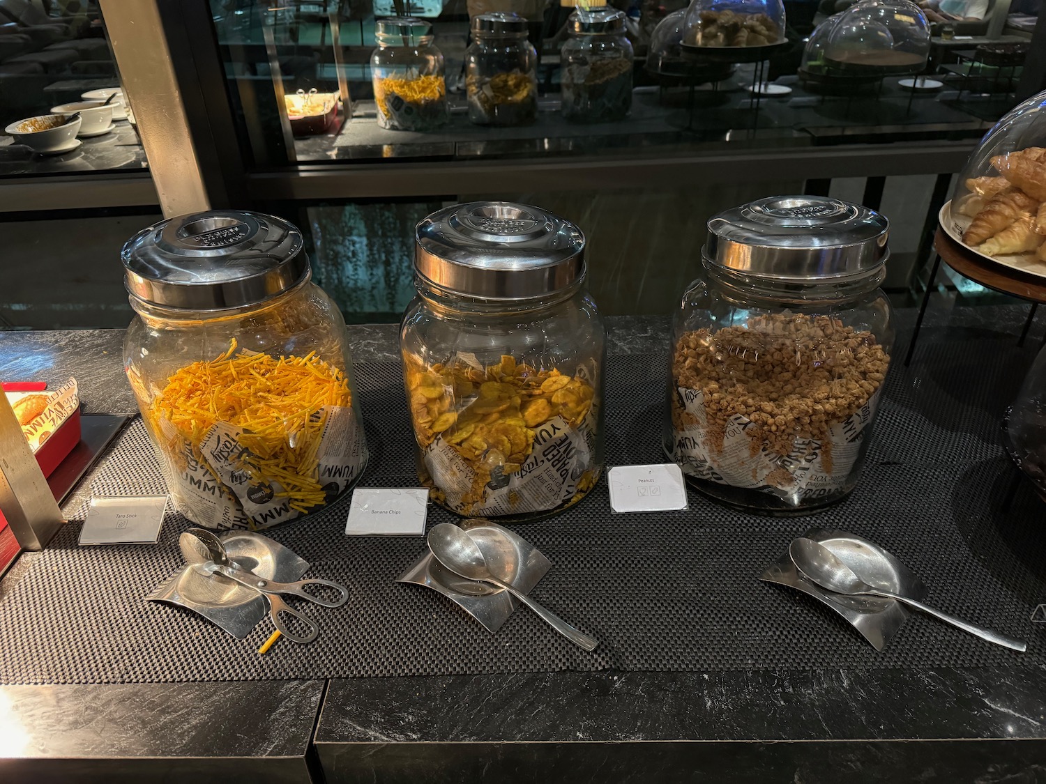 a group of glass jars with food in them