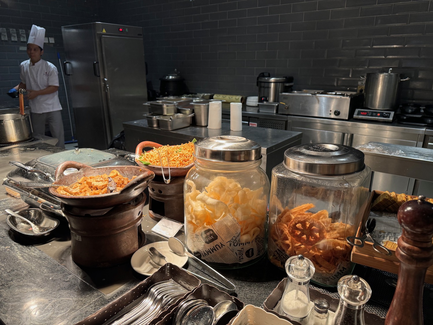 a kitchen with large jars of food