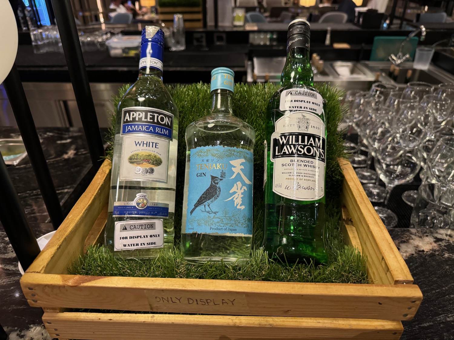 a group of bottles in a wooden box