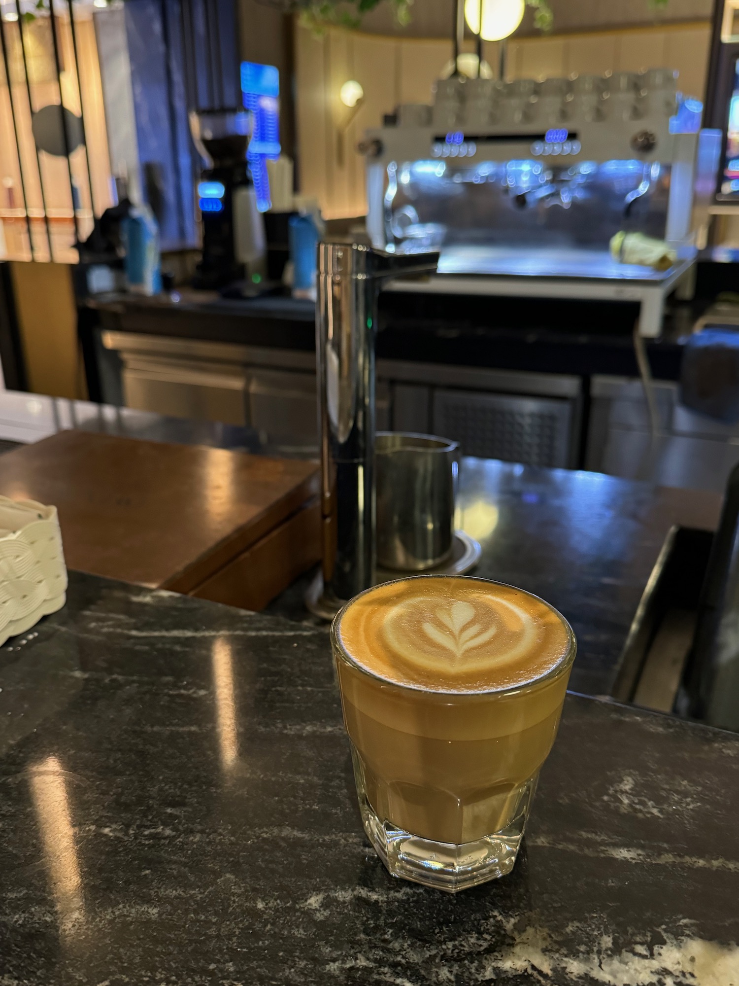 a glass of coffee on a counter