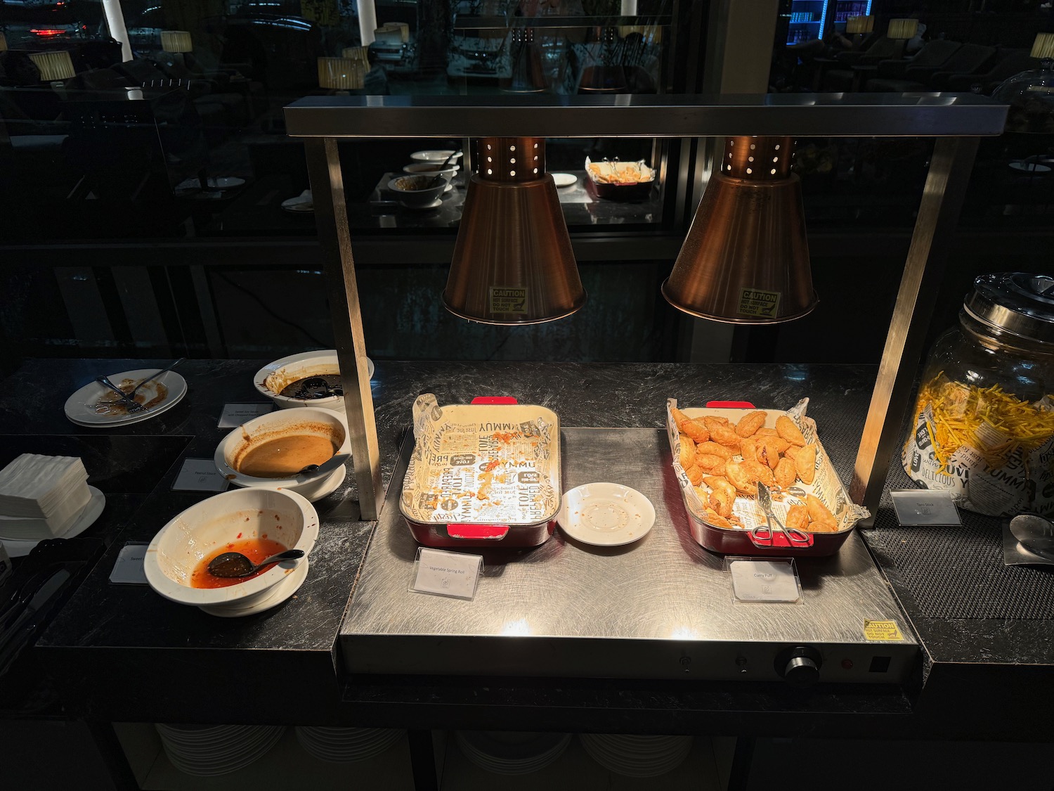 a trays of food on a counter