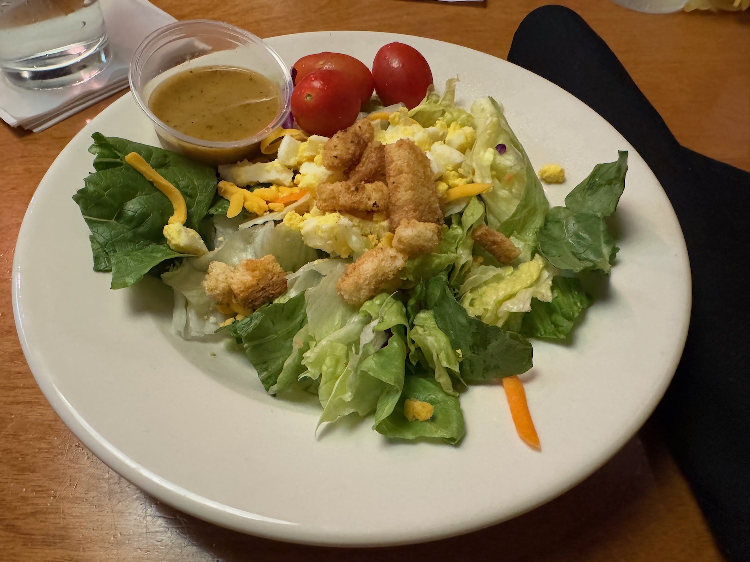 a plate of salad with dressing