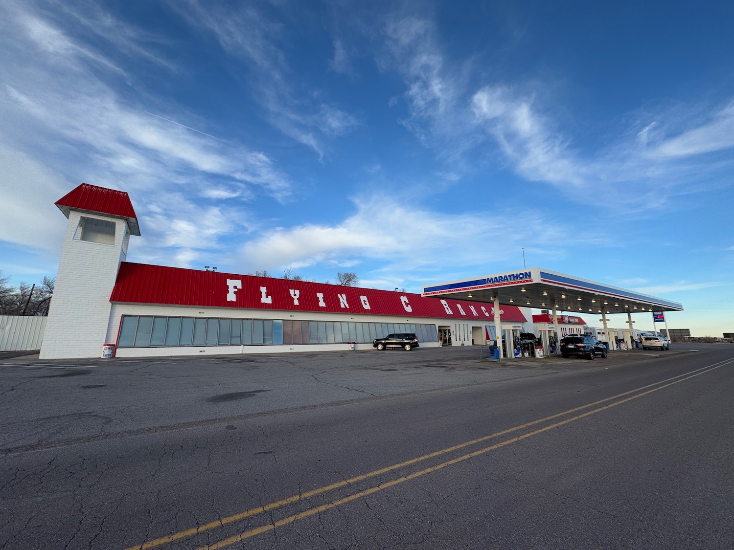 a gas station with a red roof