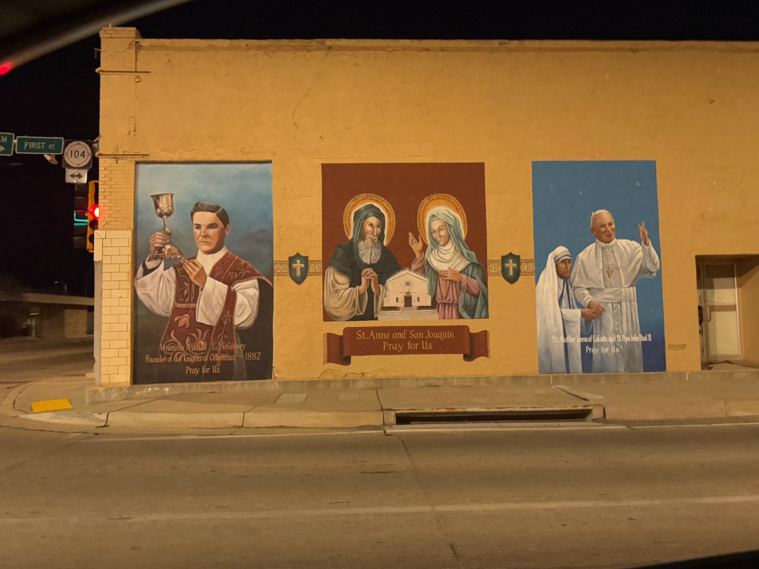 a mural of religious people on a building