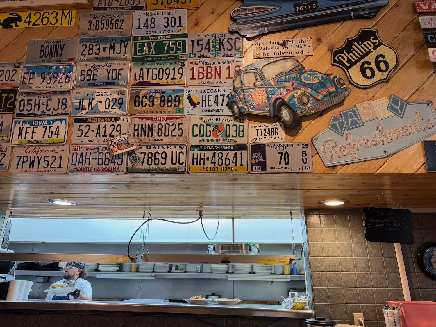 a man sitting at a counter in a restaurant