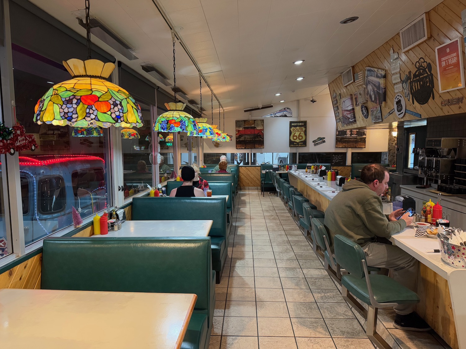 a man sitting at a table in a restaurant