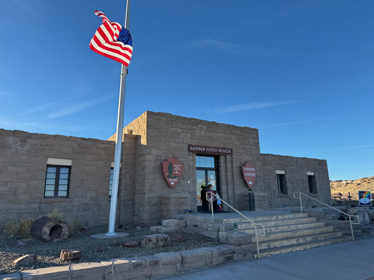 a building with a flag on the pole