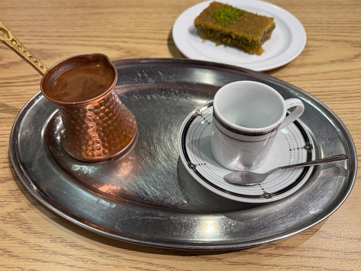 a tray with a cup and saucer on it