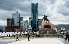 a statue of a man riding a horse in a city