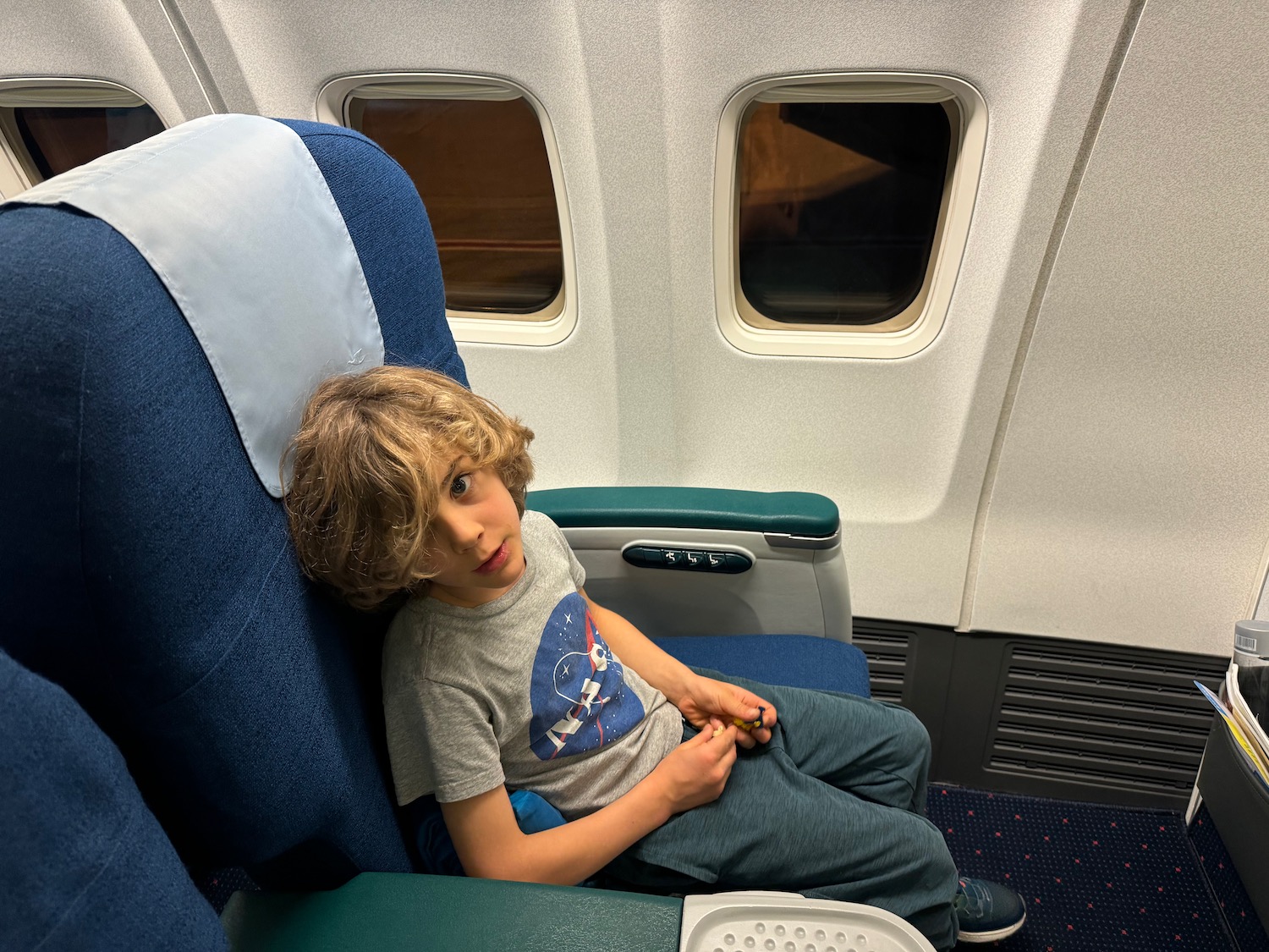 a boy sitting in a chair