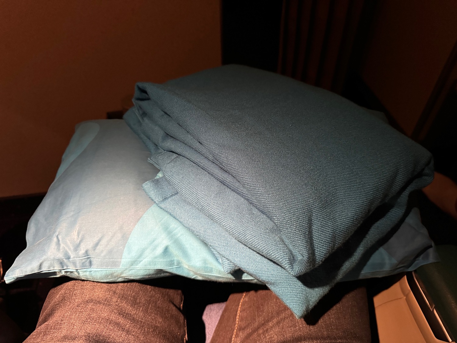 a stack of pillows on a couch