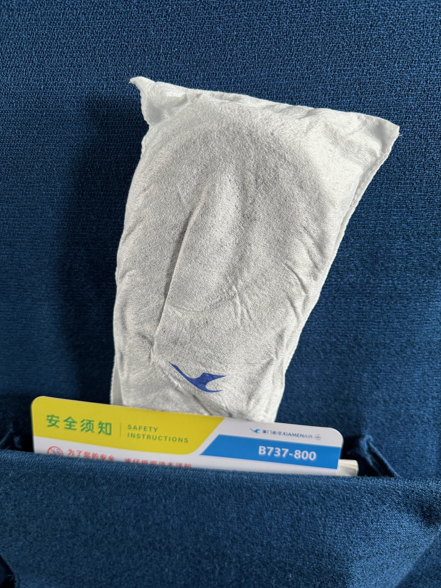 a white pillow in a pocket