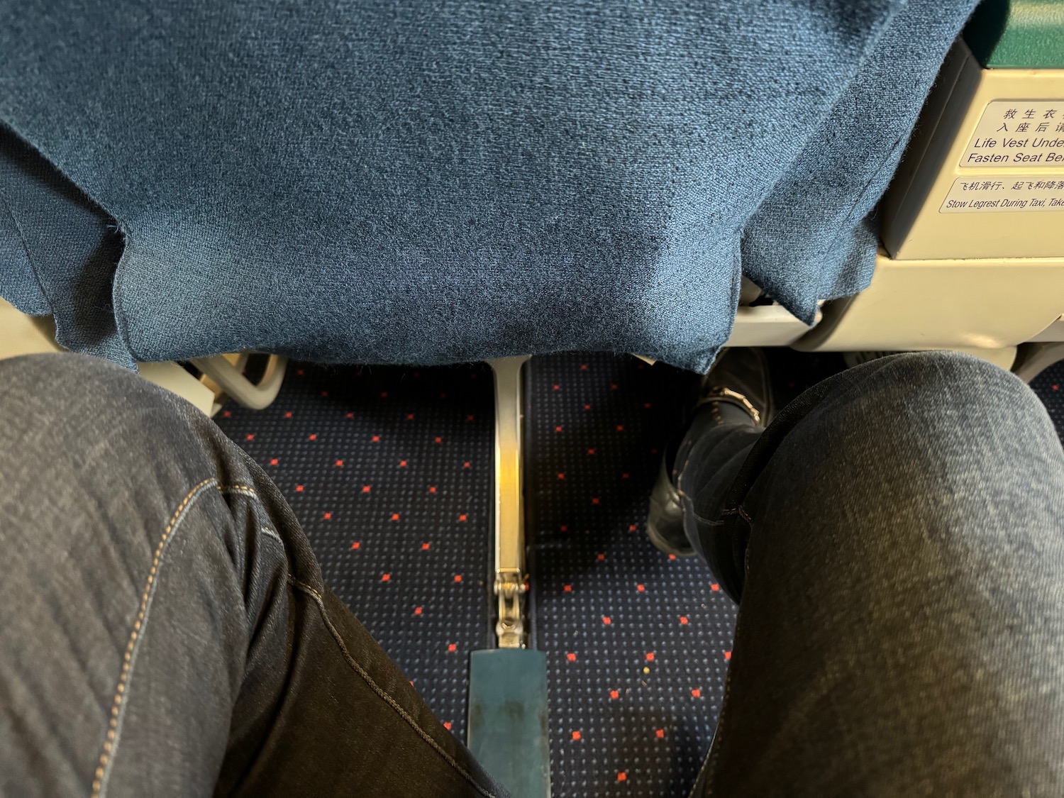 a person's legs and feet on a seat