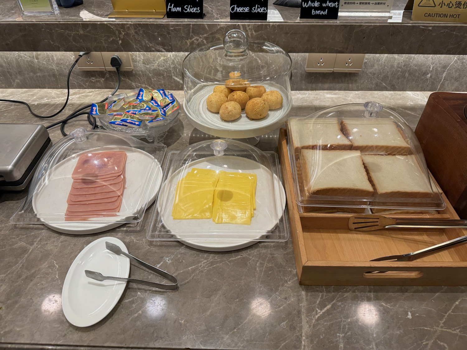 a table with plates of food and utensils