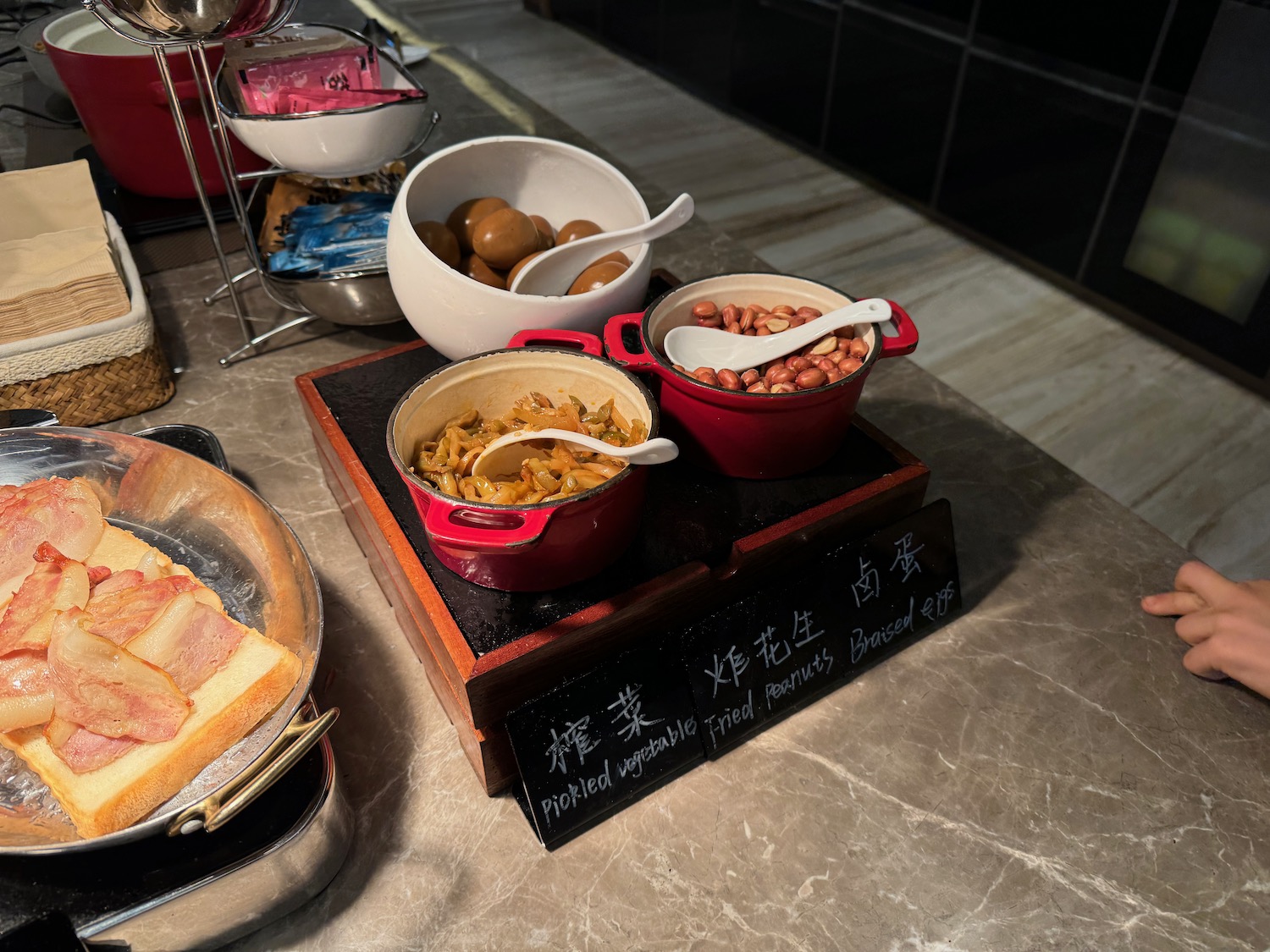 a group of bowls of food on a counter