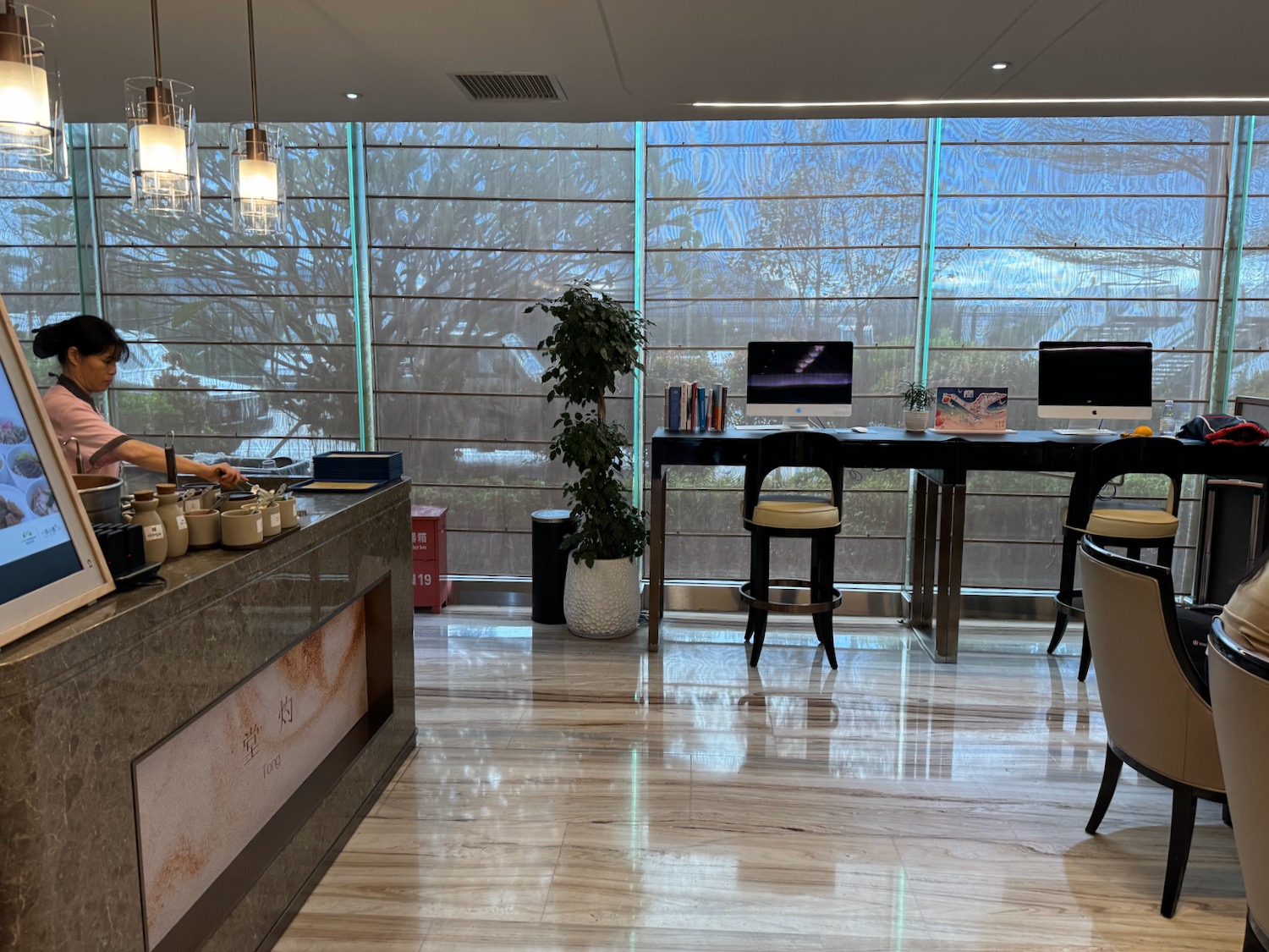 a room with a table and chairs and a computer